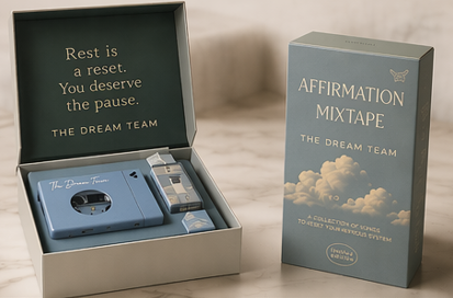 The Affirmation Mixtape cassette and cassette player styled with sage pillow, monstera leaves and watercolor cloud